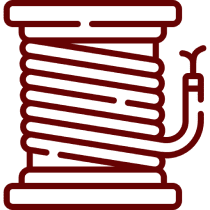Red fire hose reel on black background.